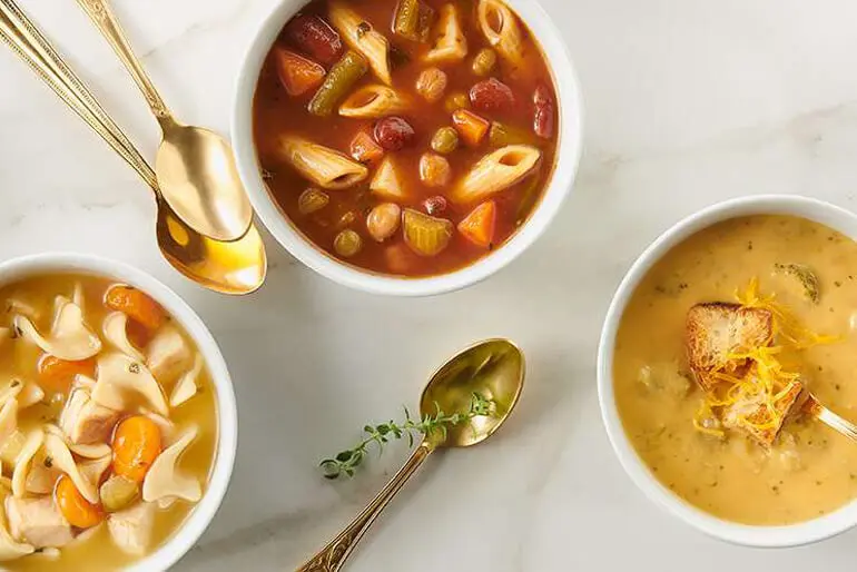 An overhead shot of three bowls of different Progresso soups